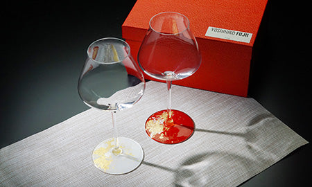 Two Kishu lacquer wine glasses in front of their red box